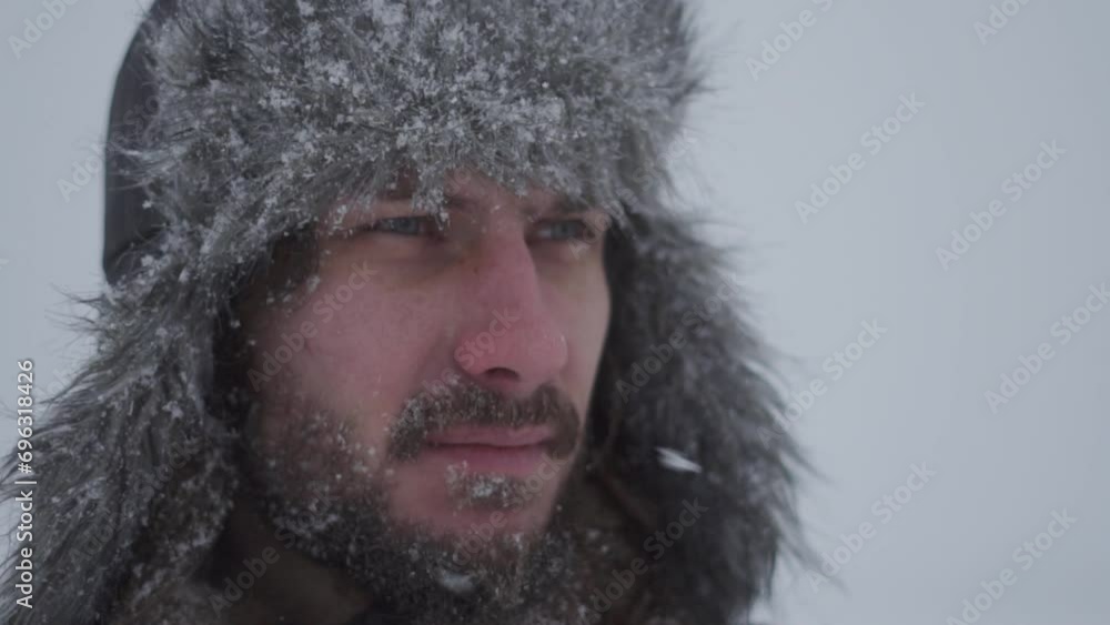 a man in a hat with earflaps in the snow a man in a hat with earflaps in the snow