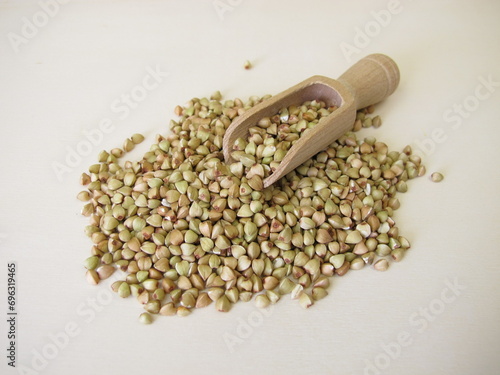 Buckwheat: hulled buckwheat grains on a wooden board photo