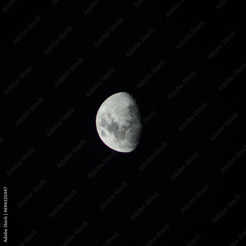 Close-up white waning crescent moon against a black night sky. Close-up white waning crescent moon against a black night sky.