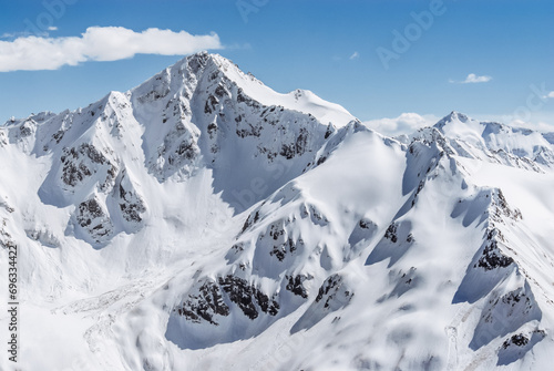 Snowy mountains. Beautiful landscape with snowy rocks. View from the top of Mount Elbrus