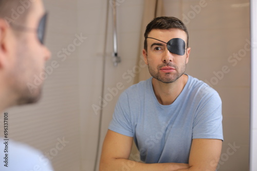 Man wearing a black eyepatch  photo