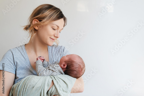 Mother and baby at home. Happy maternity and family. photo