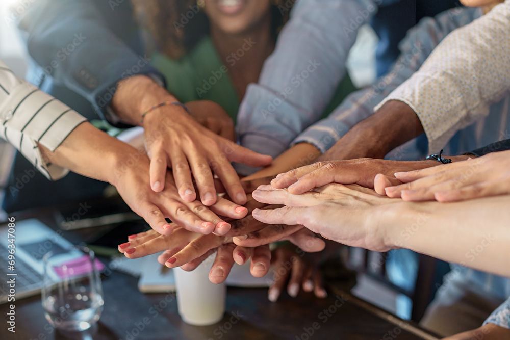Unified Hands of a Business Team - concept of teamwork empowerment and collaboration in multiethnic workplace Unified Hands of a Business Team - concept of teamwork empowerment and collaboration in multiethnic workplace