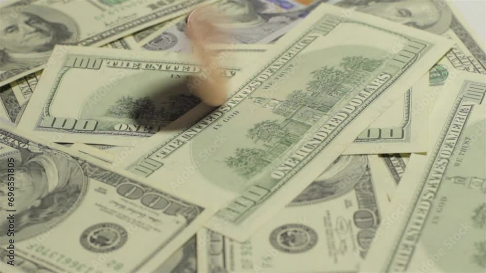 Golden Bitcoin quickly rotates on dollar bills Golden Bitcoin quickly rotates on dollar bills