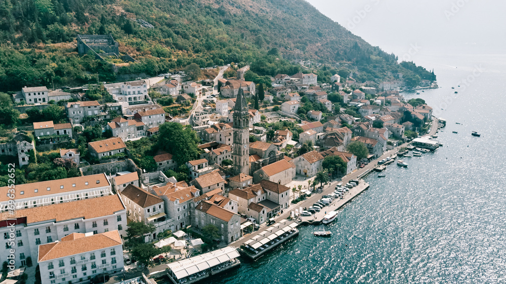 Car parking on the embankment near the Church of St. Nicholas. Perast, Montenegro. Drone