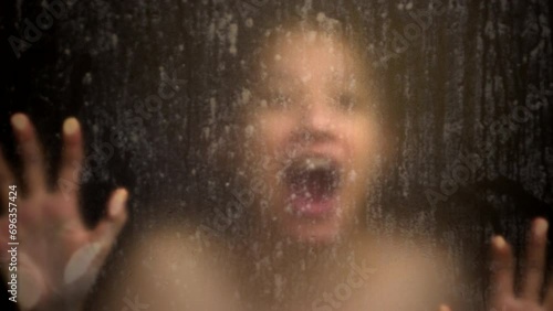 Asian pysco stress scream woman while shower hand and face blur over glass window mental problem concept photo