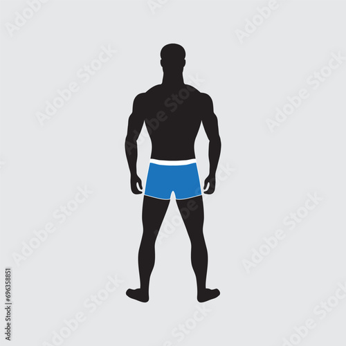 Standing guy of normal weight in swimming trunks