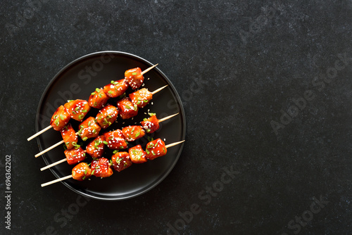 Teriyaki chicken skewers on plate