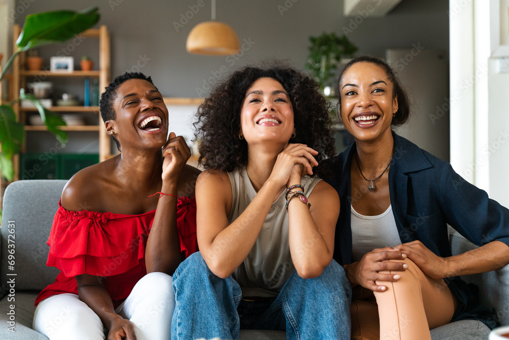 Beautiful and cheerful black and hispanic adult woman bonding and having fun at home Beautiful and cheerful black and hispanic adult woman bonding and having fun at home