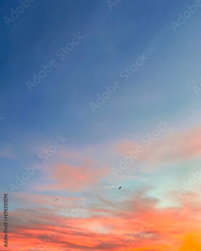 Sunset sky with colorful clouds background concept. Dramatic evening sunset. Twilight sky.