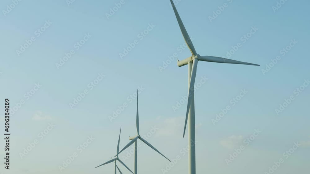 Windmills for electric power production, summer field, renewable energy Windmills for electric power production, summer field, renewable energy