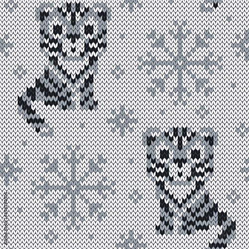 Tiger and snowflakes jacquard knitted seamless pattern.  Winter grey color background for knitwear design. Vector illustration.