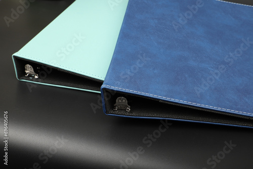 Personalized binding, leather folder cover, leather binding, binder, binder, office binding, corporate gift. Concept shot leather binding, top view, colorful photo