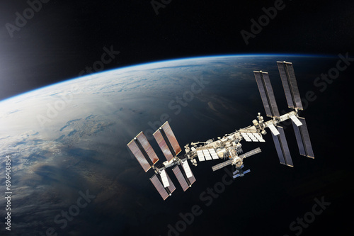 Fototapeta Naklejka Na Ścianę i Meble -  ISS over the planet Earth. Elements of this image furnished by NASA.