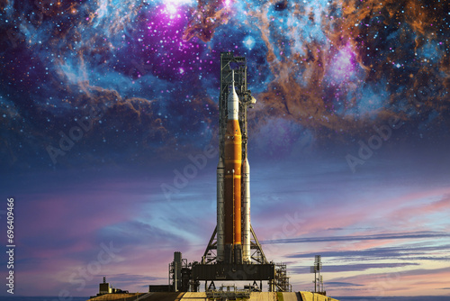 Fototapeta Naklejka Na Ścianę i Meble -  Orion spacecraft on launchpad on nebula background. Mission to the Moon. Artemis space program to research solar system. Elements of this image furnished by NASA.