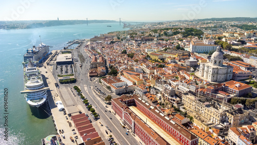 Aerial view of Lisbon city center. View of National Pantheon at right. Spectacular cruise ships moored in the port. Rooftops of Lisbon. Famous European travel destination and capital of Portugal.