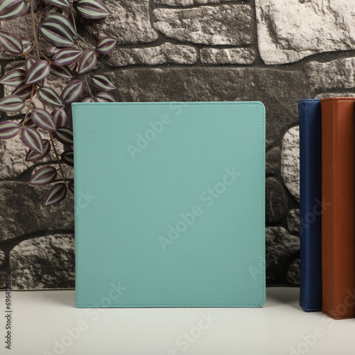 Personalized binding, leather folder cover, leather binding, binder, binder, office binding, corporate gift. Concept shot leather binding, top view, colorful photo