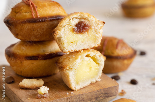 Pasticciotto leccese pastry filled with egg custard cream and sour cherry jam close up photo