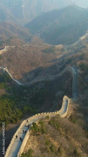 Great Wall of China and Green Mountains. Aerial View. Drone Flies Forward, Reveal Shot. Vertical Video