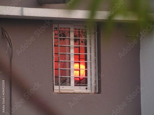 Sun reflection in Glass Window in House Sun set in mirror