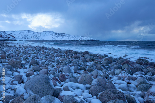 The beach of round stones. The coast of the Barents Sea. Teriberka, Russia