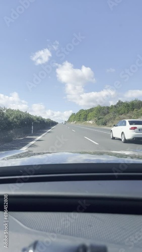 First person view, FPV, from dashcam of car driving on highway from Valencia towards Murcia, Andalusia, Spain, Europe. Road trip video in POV, vertical video photo