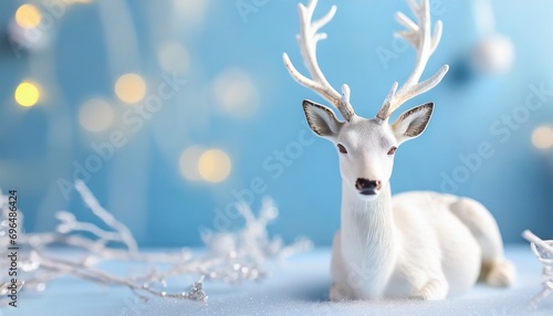 White deer on a blue background. New year concept.   © adobedesigner