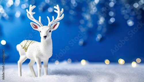 White deer on a blue background. New year concept.	
