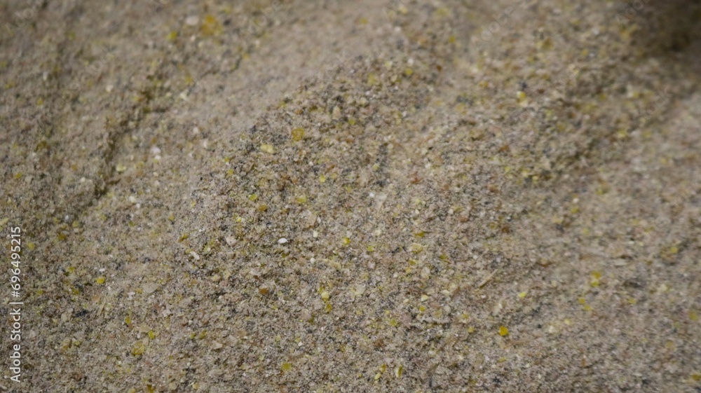 agricultural feed close-up, ground wheat and corn grain mixed with protein flour, meal, cake and bran, feeding farm poultry with homemade combined feed, crushed grains for feeding farm birds agricultural feed close-up, ground wheat and corn grain mixed with protein flour, meal, cake and bran, feeding farm poultry with homemade combined feed, crushed grains for feeding farm birds