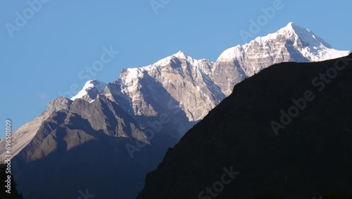View of Kangtega Mountain in the Himalayas. Trekking to the Everest base camp. Sunset in the mountains photo