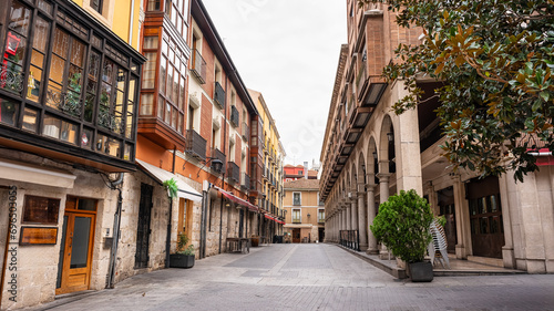 Picturesque street in the city of Valladolid with arcades in historic buildings, Spain.