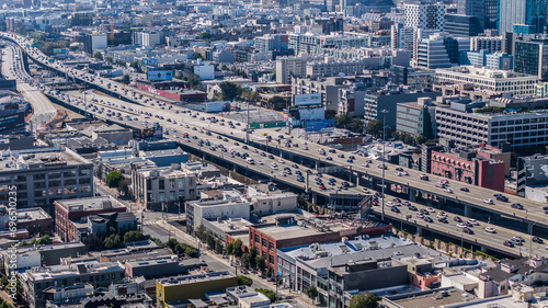 aerial cityscape view of Rincon Hill District in San Francisco with massive traffic on Interstate 80, driving to and coming from San Francisco – Oakland Bay Bridge photo
