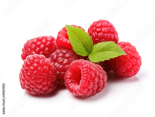 A pile of raspberries with a leaf on top.