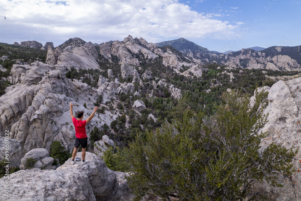 Obraz premium Man in red shirt visiting the City of Rocks National Reserve in Idaho, United States.