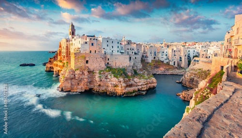 spectacular spring cityscape of polignano a mare town puglia region italy europe colorful evening seascape of adriatic sea traveling concept background photo