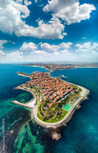 Beautiful bird's-eye night view of the old town of Nessebar, the Black Sea, Sunny Beach resort and mountains, Bulgaria.. High-altitude panoramic drone shot photo