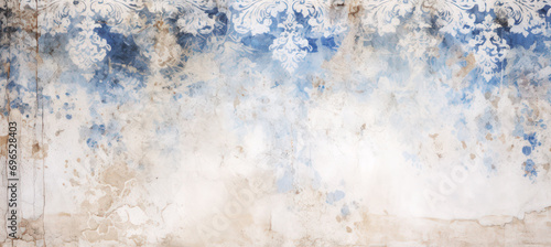Vintage Ornament Grunge Wall. Faded blue and cream floral patterns on a distressed, textured backdrop
