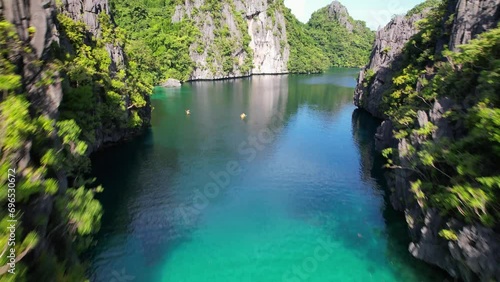 Aerial shot of Kayakers exploring tropical islands in the Philippines  photo