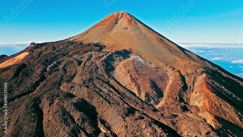Aerial view of Mount Teide active volcano in Tenerife, Canary Islands. View from above the highest peak mountain with a scenic aerial cable car and hiking trails in Tenerife, Spain. photo
