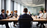 blurred people at a board meeting. Corporate job