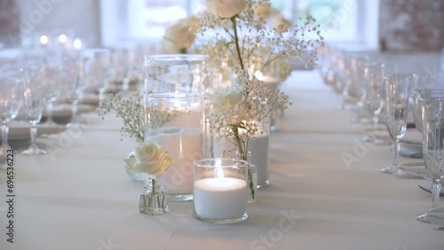 Bulk candles made of granulated wax and white decorative flowers photo