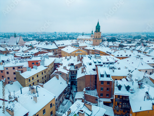 white snowy winter at European old town Lublin, snow storm and snowfall over roof at ancient Poland, Europe aerial