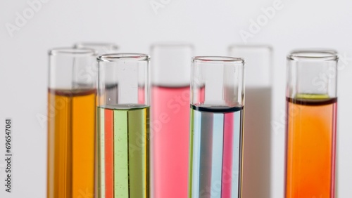 Close up shot of laboratory glassware on white background. Test tubes with colorful liquids in laboratory, scientific expertise.