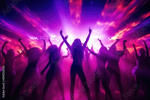 Dancing crowd against an explosion of color and light