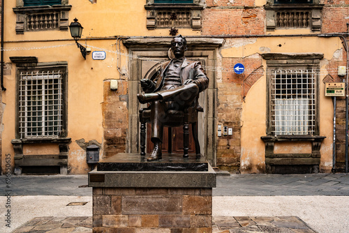 LUCCA, ITALY, APRIL 16, 2017: Detail of a bronze statue of Giacomo Puccini, famous Italian opera composer, in downtown of Lucca his hometown. Tuscany, Italy, Europe.