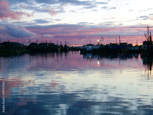 Silhouettes of Industrial fishing vessels on shore. After sunset. Dry docking © Terri_Crozier 