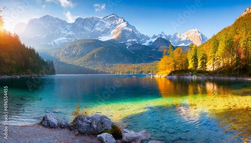 impressive summer sunrise on eibsee lake with zugspitze mountain range sunny outdoor scene in german alps bavaria germany europe beauty of nature concept background #696554455