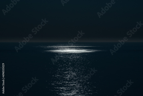 Fototapeta Naklejka Na Ścianę i Meble -  Reflection of full moon in the calm sea