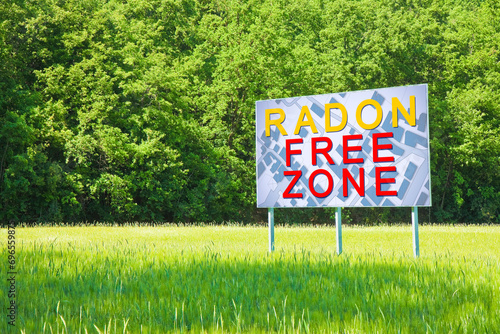 Wallpaper Mural RADON GAS FREE ZONE: concept with a vacant land free from the natural and dangerous radioactive gas that comes from the earth - advertising billboard in a rural scene with city map Torontodigital.ca