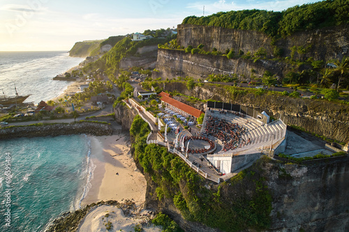 The amphitheater of the local show Kecak Dance at Melasti Beach over a cliff near the ocean on the island of Bali.